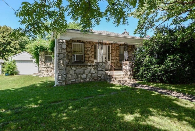1305 S Kimbrough Ave, Springfield, MO 65807 - view of front of property with stone siding, a porch, a front yard, and cooling unit