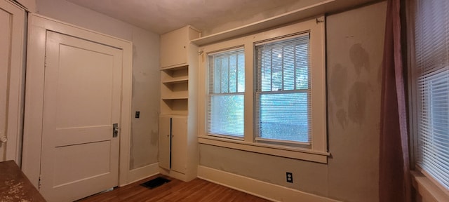 1305 S Kimbrough Ave, Springfield, MO 65807 - doorway featuring dark wood-style flooring and baseboards