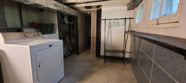 1305 S Kimbrough Ave, Springfield, MO 65807 - laundry area with washer / clothes dryer and light tile patterned flooring