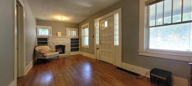 1305 S Kimbrough Ave, Springfield, MO 65807 - entryway featuring a stone fireplace and wood finished floors