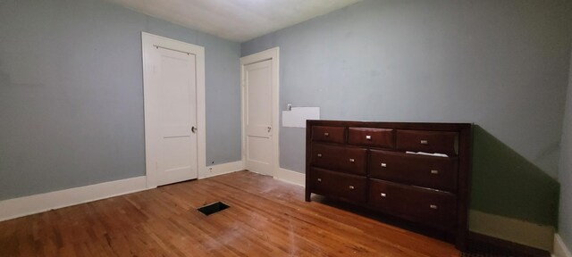 1305 S Kimbrough Ave, Springfield, MO 65807 - unfurnished bedroom with wood finished floors and baseboards