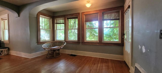 1305 S Kimbrough Ave, Springfield, MO 65807 - spare room featuring wood finished floors and arched walkways