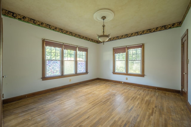 400 S Jefferson St, Neosho, MO 64850 - unfurnished room featuring hardwood / wood-style floors and baseboards
