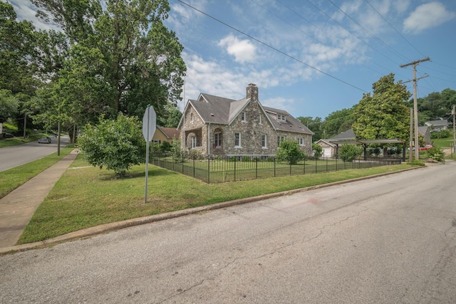 400 S Jefferson St, Neosho, MO 64850 - english style home featuring stone siding and a chimney