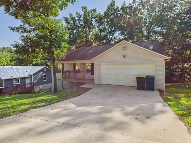 1007 S Walnut St, Harrison, AR 72601 - ranch-style home featuring a front lawn, driveway, a garage, and a porch