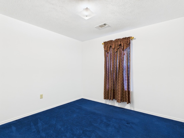 1007 S Walnut St, Harrison, AR 72601 - empty room with dark colored carpet and a textured ceiling