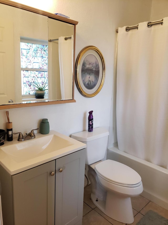 1108 E Cleveland Ave, Monett, MO 65708 - bathroom featuring vanity, shower / bath combination with curtain, and tile patterned flooring