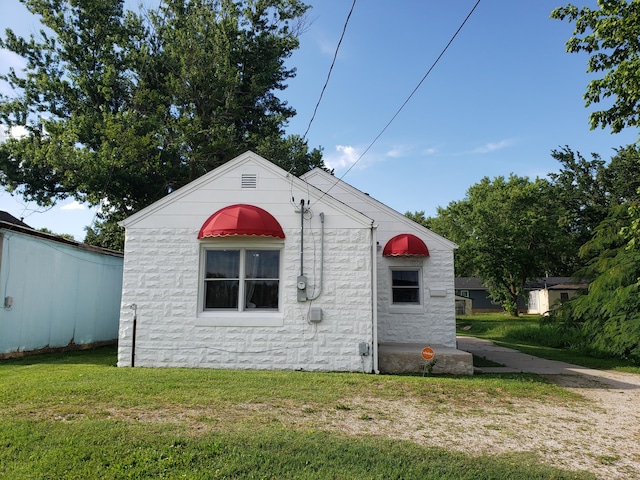 1108 E Cleveland Ave, Monett, MO 65708 - view of property exterior featuring a yard