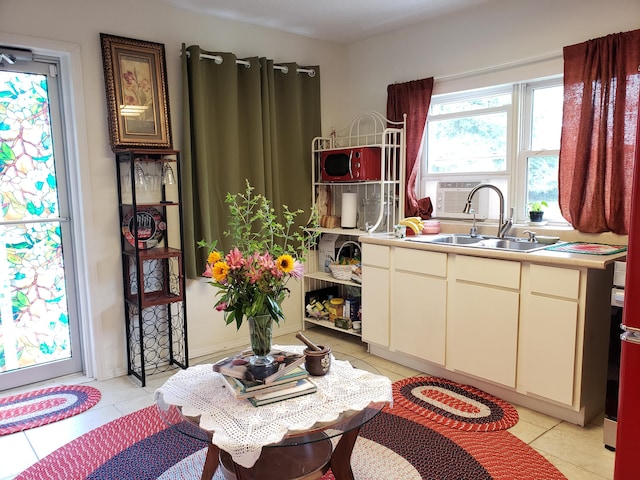 1108 E Cleveland Ave, Monett, MO 65708 - kitchen featuring light tile patterned floors and light countertops