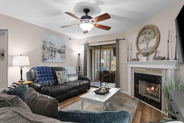 366 Wimbledon Dr Unit 4, Branson, MO 65616 - living area featuring wood finished floors, ceiling fan, and a tile fireplace
