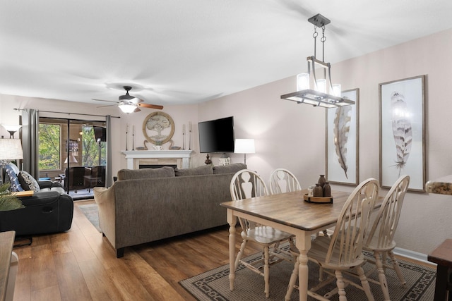 366 Wimbledon Dr Unit 4, Branson, MO 65616 - dining room featuring a ceiling fan, wood finished floors, and a fireplace