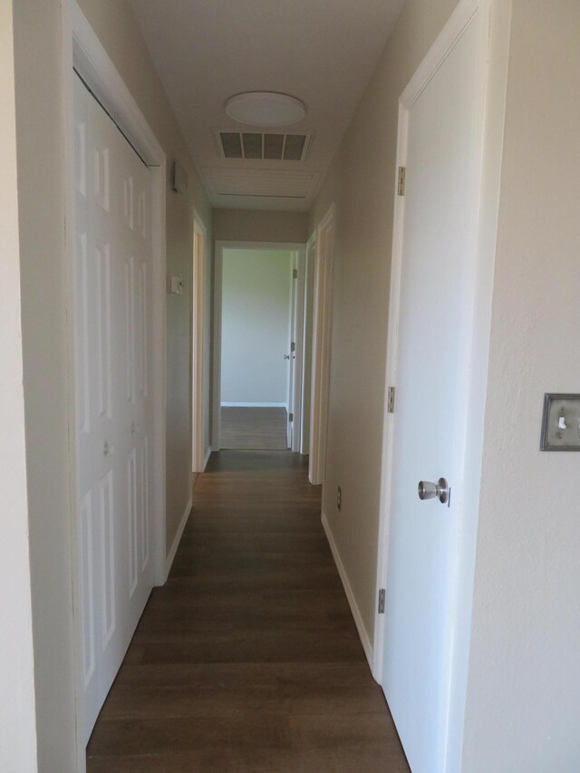 1007 E Parkview St, Ozark, MO 65721 - hallway with dark wood-style flooring and baseboards
