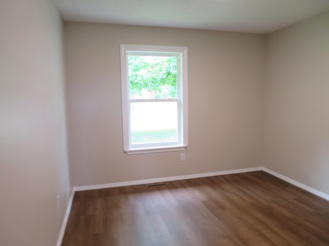 1007 E Parkview St, Ozark, MO 65721 - unfurnished room with dark wood-style flooring and baseboards