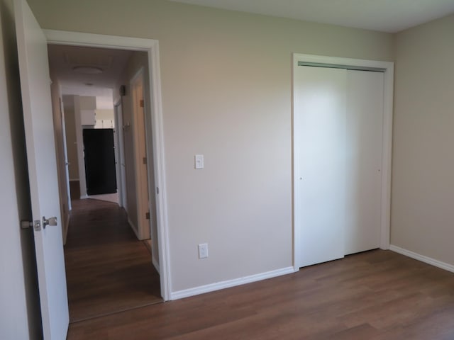 1007 E Parkview St, Ozark, MO 65721 - unfurnished bedroom with wood finished floors and a closet