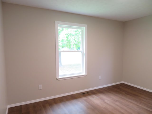 1007 E Parkview St, Ozark, MO 65721 - unfurnished room featuring wood finished floors and baseboards