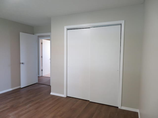 1007 E Parkview St, Ozark, MO 65721 - unfurnished bedroom with wood finished floors and a closet