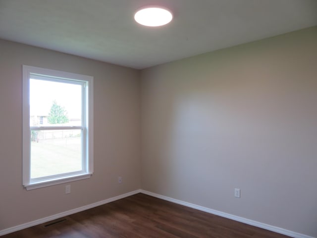 1007 E Parkview St, Ozark, MO 65721 - spare room with plenty of natural light and dark wood-style floors