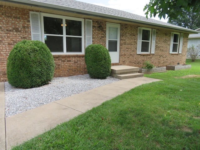 1007 E Parkview St, Ozark, MO 65721 - view of front of house with brick siding, a front yard, and roof with shingles