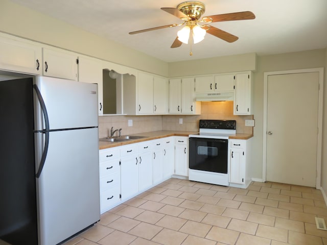 1007 E Parkview St, Ozark, MO 65721 - kitchen with freestanding refrigerator, white electric range oven, decorative backsplash, and light countertops