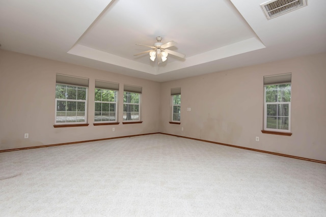 1030 Harris Blvd, Ozark, MO 65721 - carpeted empty room with a tray ceiling, a ceiling fan, and healthy amount of natural light