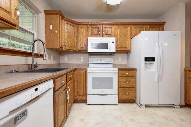 1030 Harris Blvd, Ozark, MO 65721 - kitchen with white appliances and brown cabinetry