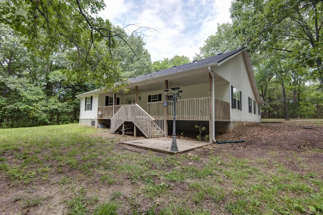 1030 Harris Blvd, Ozark, MO 65721 - rear view of property with stairs and a porch