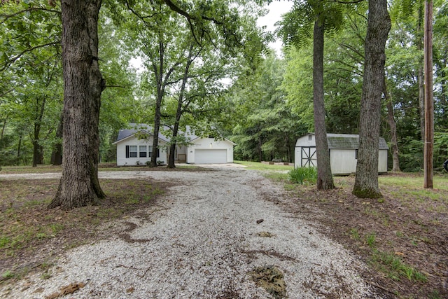 1030 Harris Blvd, Ozark, MO 65721 - view of front of house featuring a shed and driveway