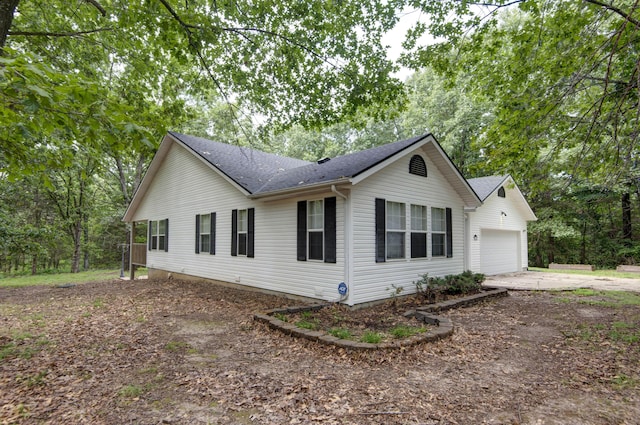 1030 Harris Blvd, Ozark, MO 65721 - view of front of home featuring driveway, a shingled roof, and a garage