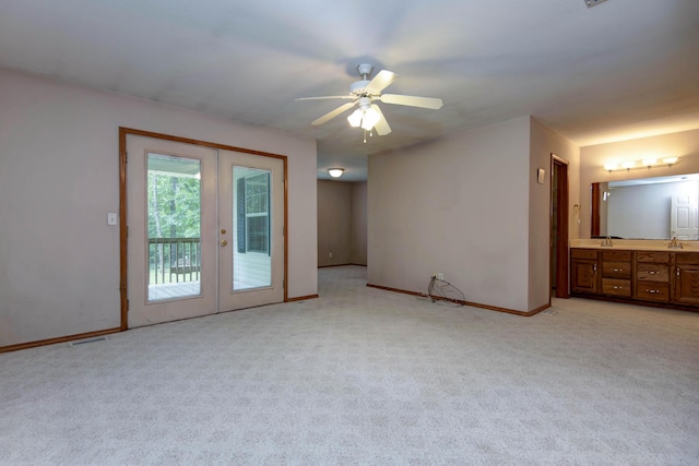 1030 Harris Blvd, Ozark, MO 65721 - spare room with french doors, light colored carpet, and ceiling fan