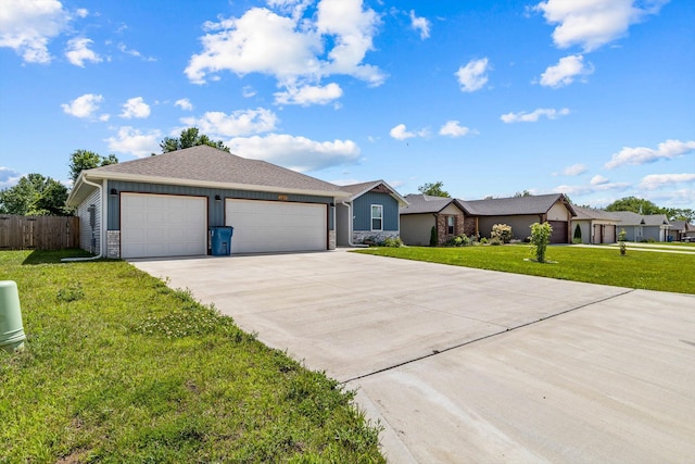 200 E Rosalie St, Strafford, MO 65757 - ranch-style home featuring concrete driveway, an attached garage, stone siding, and board and batten siding