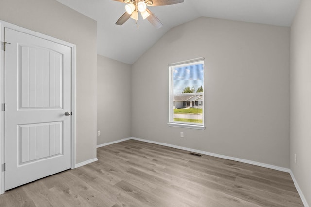 200 E Rosalie St, Strafford, MO 65757 - unfurnished bedroom featuring light wood finished floors, vaulted ceiling, and a ceiling fan
