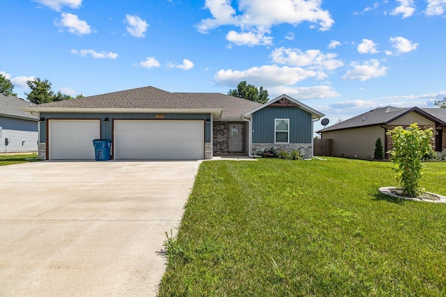 200 E Rosalie St, Strafford, MO 65757 - single story home featuring board and batten siding, concrete driveway, an attached garage, a front lawn, and stone siding