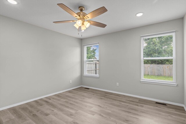 200 E Rosalie St, Strafford, MO 65757 - empty room with light wood-style floors, a ceiling fan, and recessed lighting