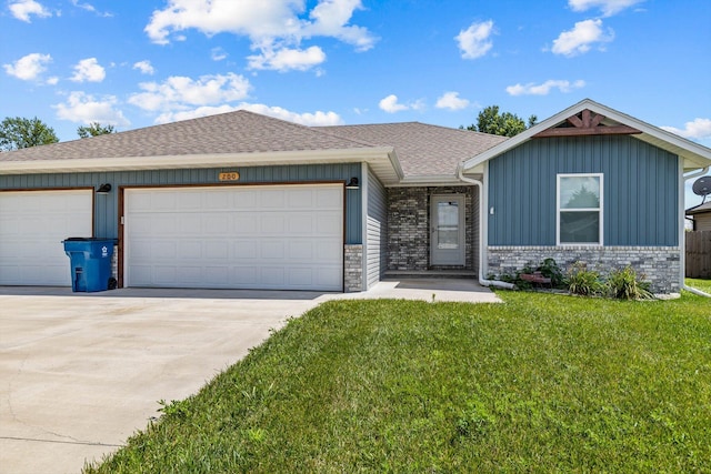 200 E Rosalie St, Strafford, MO 65757 - single story home featuring concrete driveway, an attached garage, a front yard, board and batten siding, and roof with shingles