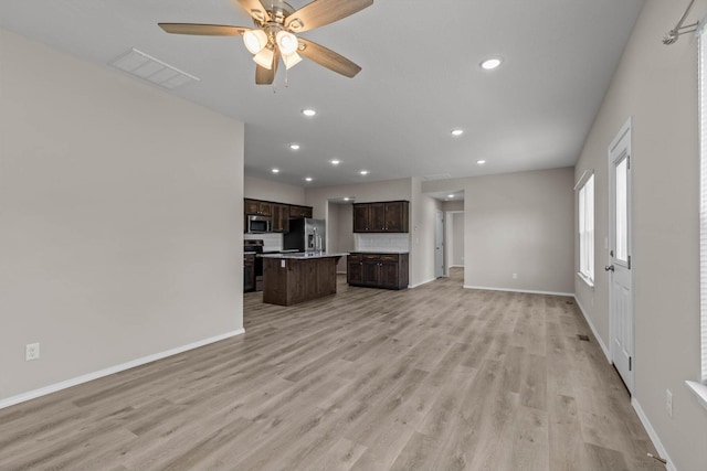 200 E Rosalie St, Strafford, MO 65757 - unfurnished living room with light wood-style floors, recessed lighting, and a ceiling fan