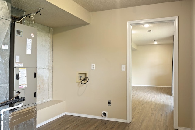 1813 Boswell Ave, Branson, MO 65616 - laundry room featuring hookup for an electric dryer, hookup for a washing machine, wood finished floors, and a textured ceiling