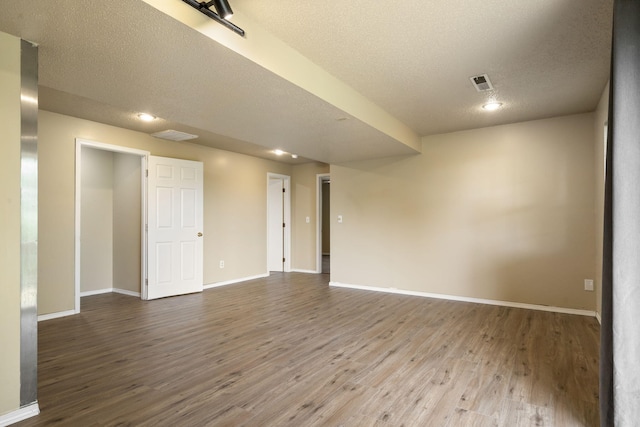 1813 Boswell Ave, Branson, MO 65616 - empty room featuring a textured ceiling, wood finished floors, and recessed lighting