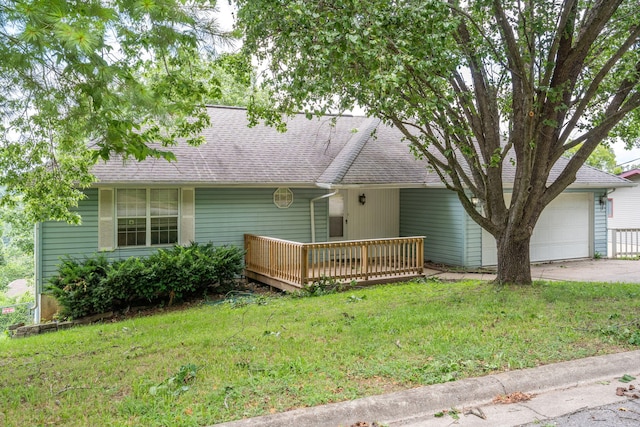 1813 Boswell Ave, Branson, MO 65616 - rear view of house with an attached garage, a deck, a yard, and driveway