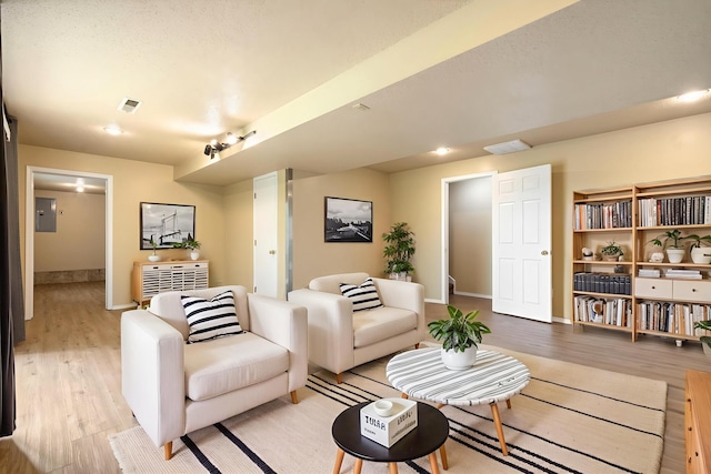 1813 Boswell Ave, Branson, MO 65616 - living room with light wood-type flooring and electric panel