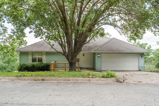 1813 Boswell Ave, Branson, MO 65616 - view of front facade with a garage, roof with shingles, and driveway