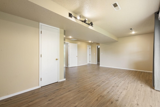 1813 Boswell Ave, Branson, MO 65616 - empty room with wood finished floors and a textured ceiling