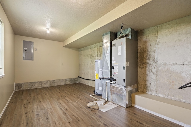 1813 Boswell Ave, Branson, MO 65616 - basement featuring electric panel, wood finished floors, electric water heater, and a textured ceiling