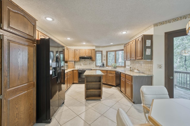 636 Crader Ct, Springfield, MO 65802 - kitchen featuring black appliances, healthy amount of natural light, decorative backsplash, a textured ceiling, and recessed lighting