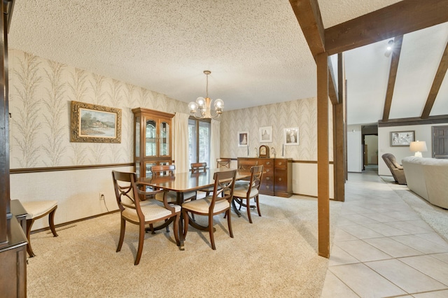 636 Crader Ct, Springfield, MO 65802 - dining space featuring wallpapered walls, a chandelier, light colored carpet, and a textured ceiling