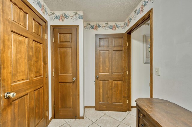 636 Crader Ct, Springfield, MO 65802 - entrance foyer featuring a textured ceiling and light tile patterned flooring