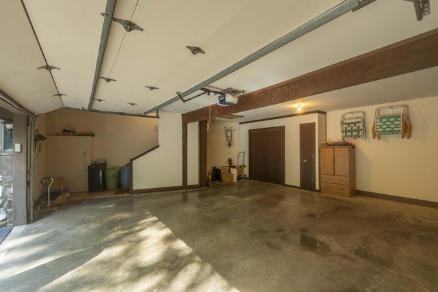 636 Crader Ct, Springfield, MO 65802 - garage featuring a garage door opener and baseboards