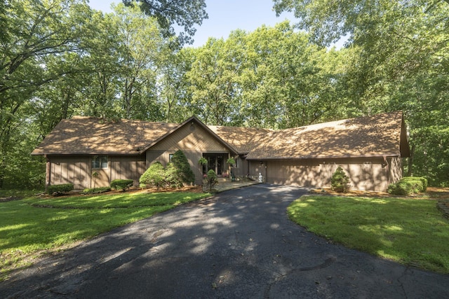 636 Crader Ct, Springfield, MO 65802 - view of front of home featuring asphalt driveway, a front yard, and roof with shingles