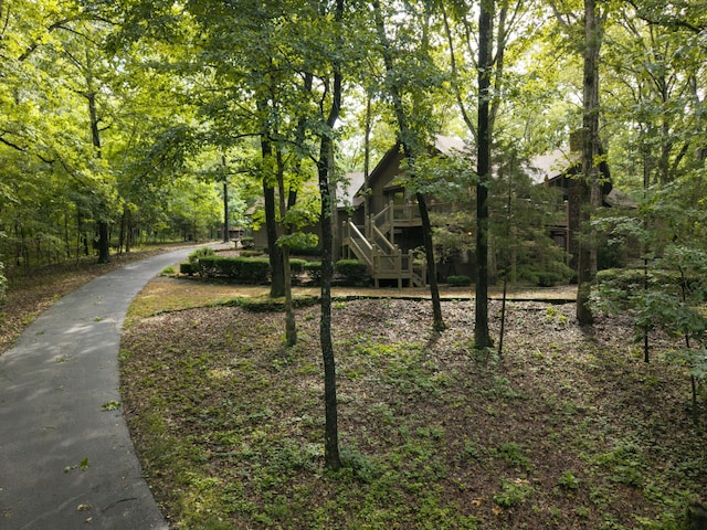 636 Crader Ct, Springfield, MO 65802 - surrounding community featuring stairs and a forest view