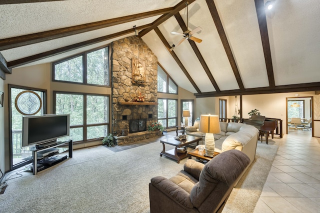 636 Crader Ct, Springfield, MO 65802 - tiled living area with high vaulted ceiling, beam ceiling, a stone fireplace, and ceiling fan