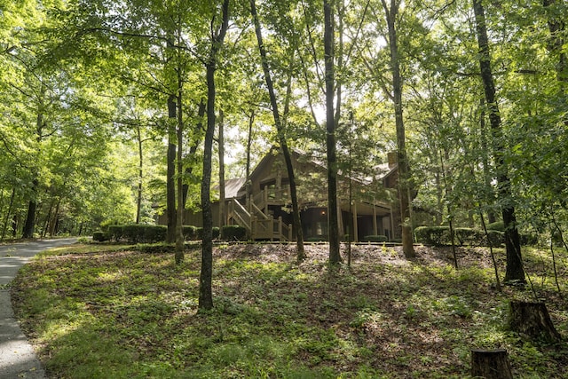 636 Crader Ct, Springfield, MO 65802 - view of home's exterior with a chimney and stairs